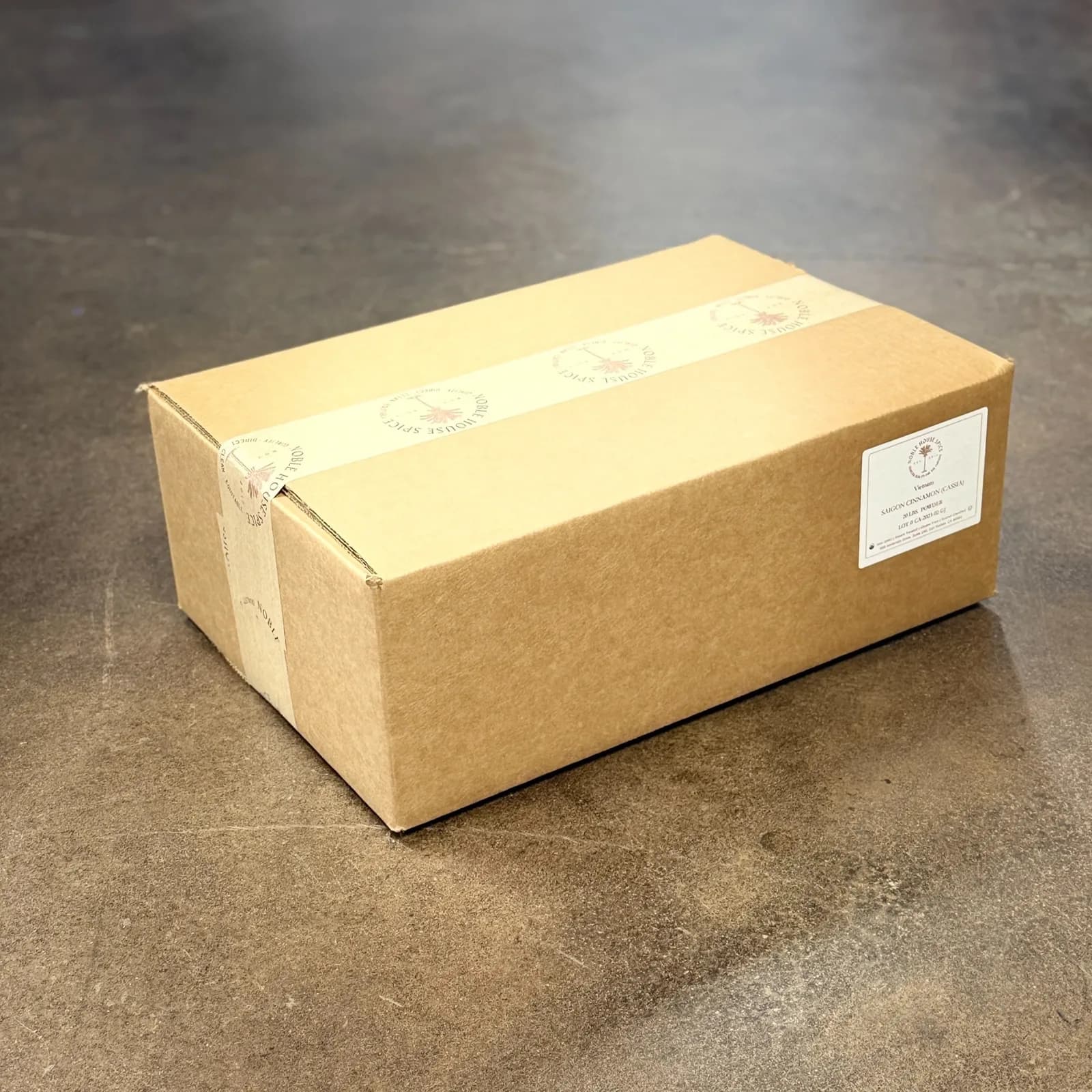 A 20 lb bulk box of Noble House Spice peppercorns
